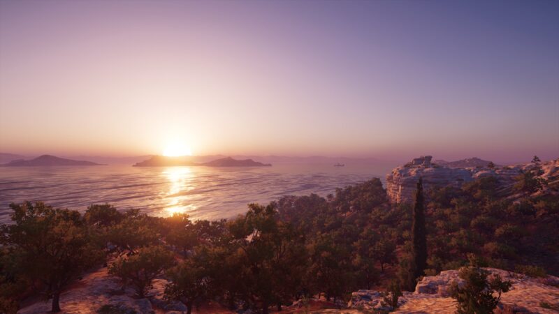 A picturesque sunset illuminates the tranquil sea, casting warm hues over rocky hills and lush greenery, with distant islands faintly visible on the horizon.