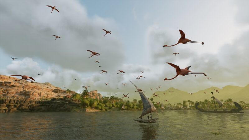 A tranquil river scene features a sailing boat surrounded by flamingos in flight, set against rocky hills and lush greenery under a partly cloudy sky.