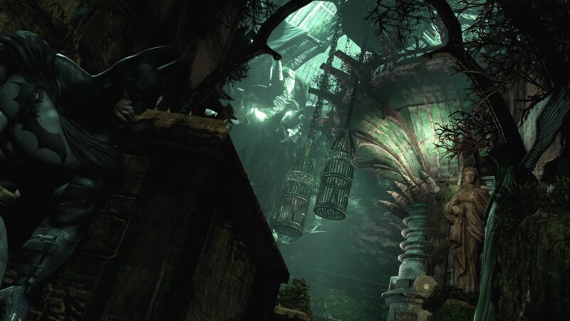 A dimly lit, gothic environment features shadowy stone structures, intricate arches, and a large statue amidst atmospheric lighting, highlighting a sense of mystery and decay.