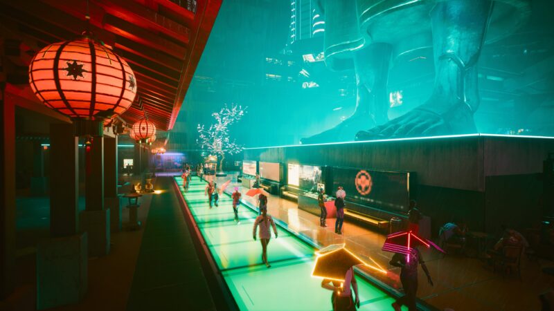 A neon-lit urban scene features a reflective waterway lined with lanterns, a giant statue in the background, and figures walking along the vibrant path, creating a futuristic atmosphere.