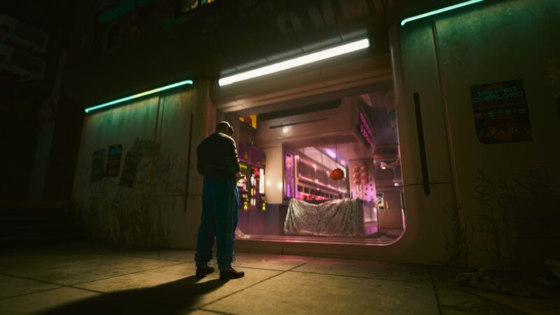 A solitary figure stands in front of a neon-lit storefront, surrounded by vibrant colours and futuristic architecture, with a glowing sign and atmospheric reflections enhancing the cyberpunk aesthetic.