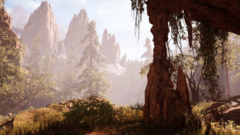 A serene landscape featuring towering, jagged mountains and lush greenery, with sunlight filtering through trees and illuminating a rocky foreground.