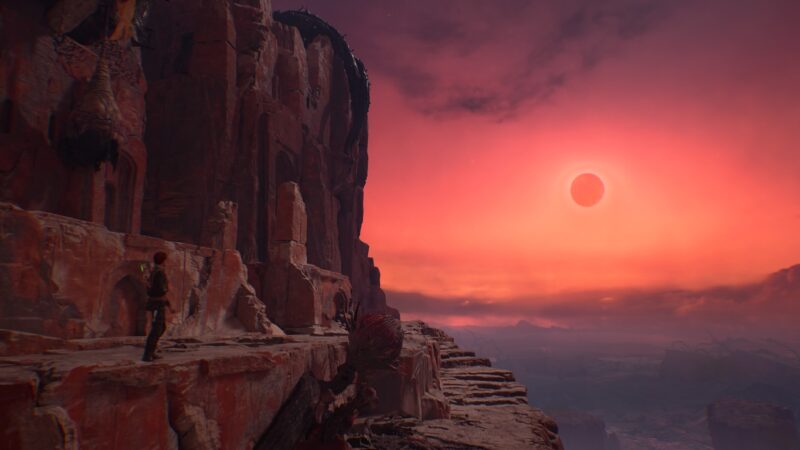 A character stands on a rocky ledge overlooking a vast canyon under a vibrant sunset sky, featuring deep reds and purples, with a celestial body partially obscured by an atmosphere.