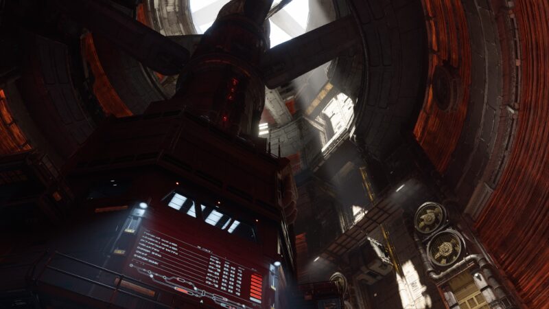 A detailed industrial setting with towering structures, red-lit panels displaying data, and shafts of light filtering from above, creating a dramatic atmosphere.