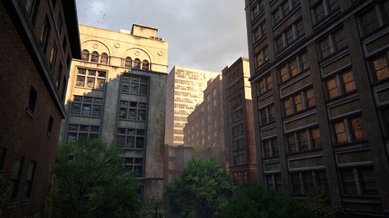 Sunlight filters through tall buildings in an overgrown urban setting, highlighting weathered architecture and greenery in a misty atmosphere.