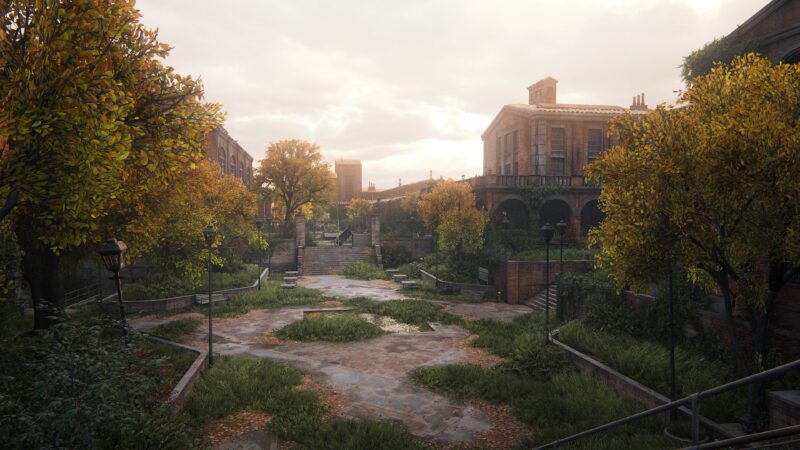 A desolate urban area features overgrown vegetation, crumbling pathways, and aged buildings under a cloudy sky, creating a somber atmosphere with scattered lampposts and autumn foliage.