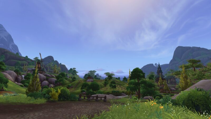 A tranquil landscape features rolling hills, lush greenery, scattered trees, and a clear sky with wispy clouds, creating a serene natural environment.