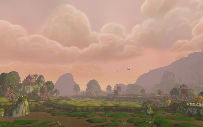 A serene landscape features rolling green hills, gentle slopes, and distant mountains under a pastel sky with soft clouds, complemented by small rustic buildings and a calm waterway.