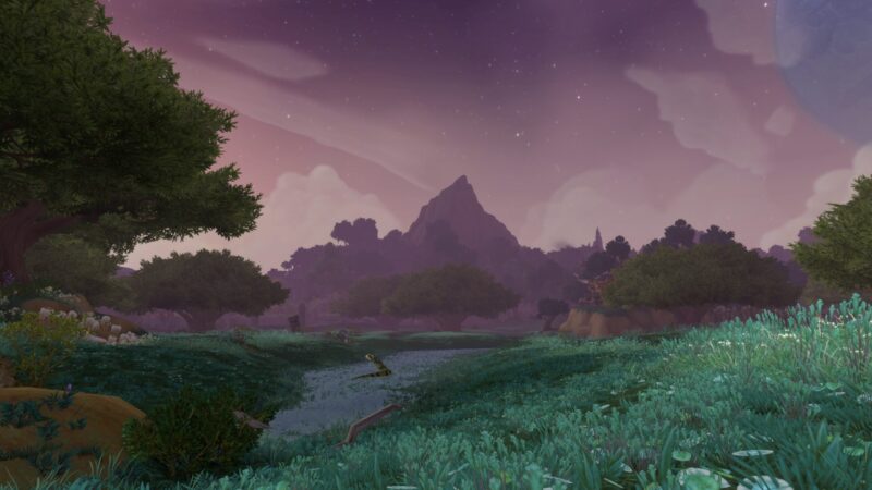 A serene landscape featuring a tranquil river winding through lush greenery, with distant mountains silhouetted against a purple-hued sky speckled with stars and wispy clouds.